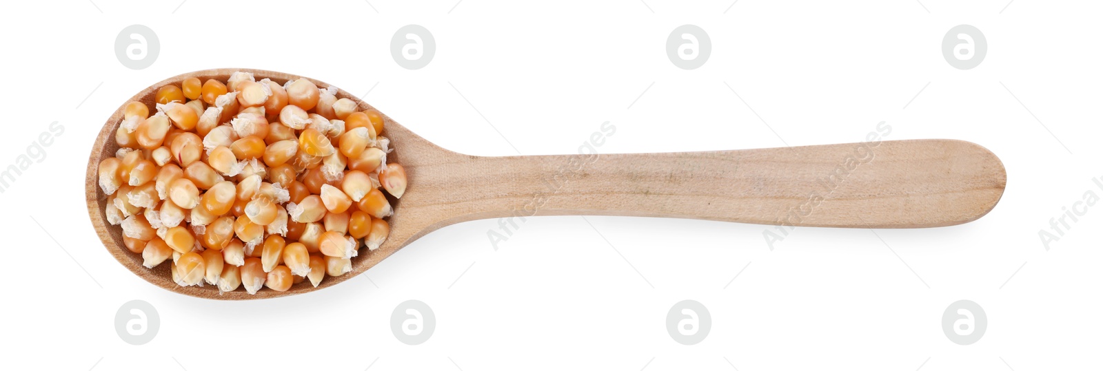 Photo of Fresh corn kernels in wooden spoon isolated on white, top view