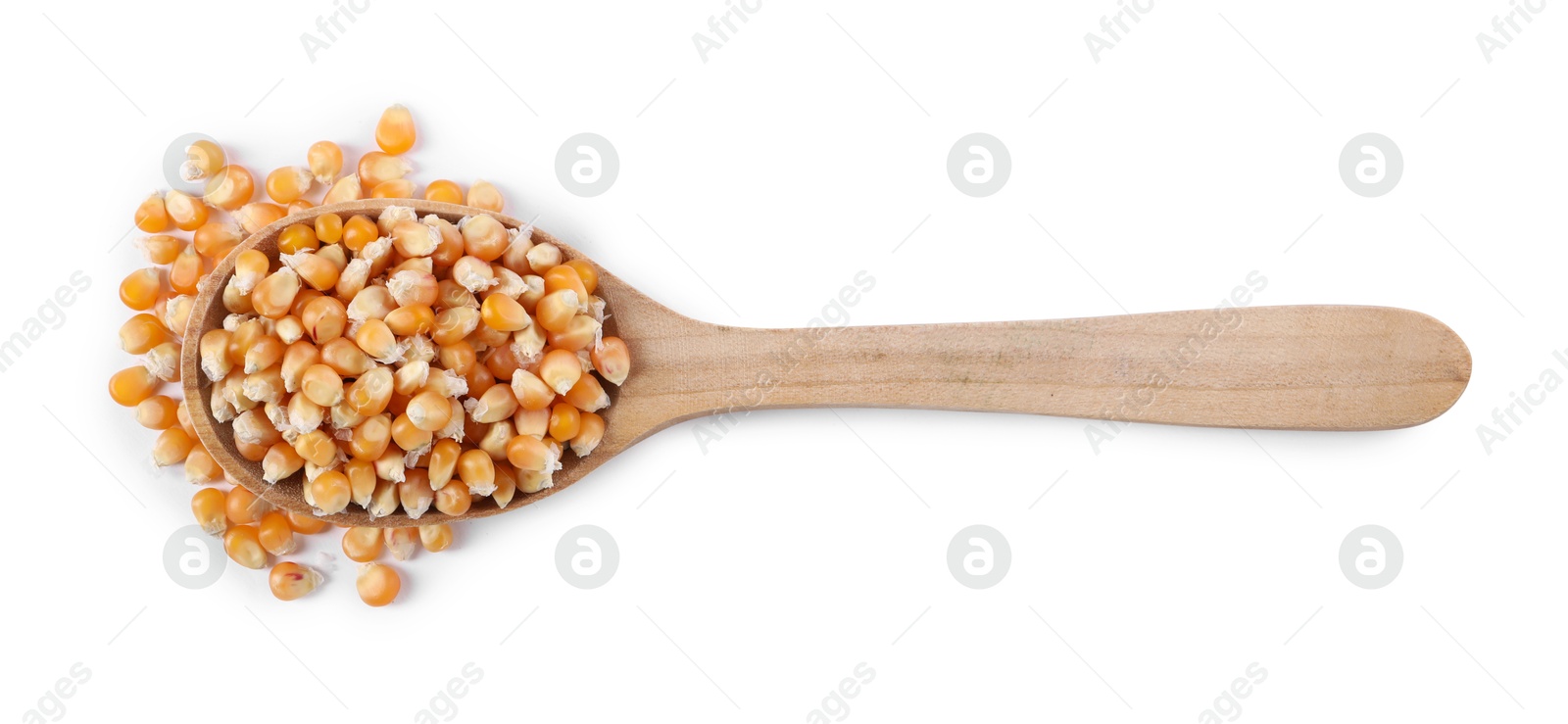 Photo of Fresh corn kernels in wooden spoon isolated on white, top view