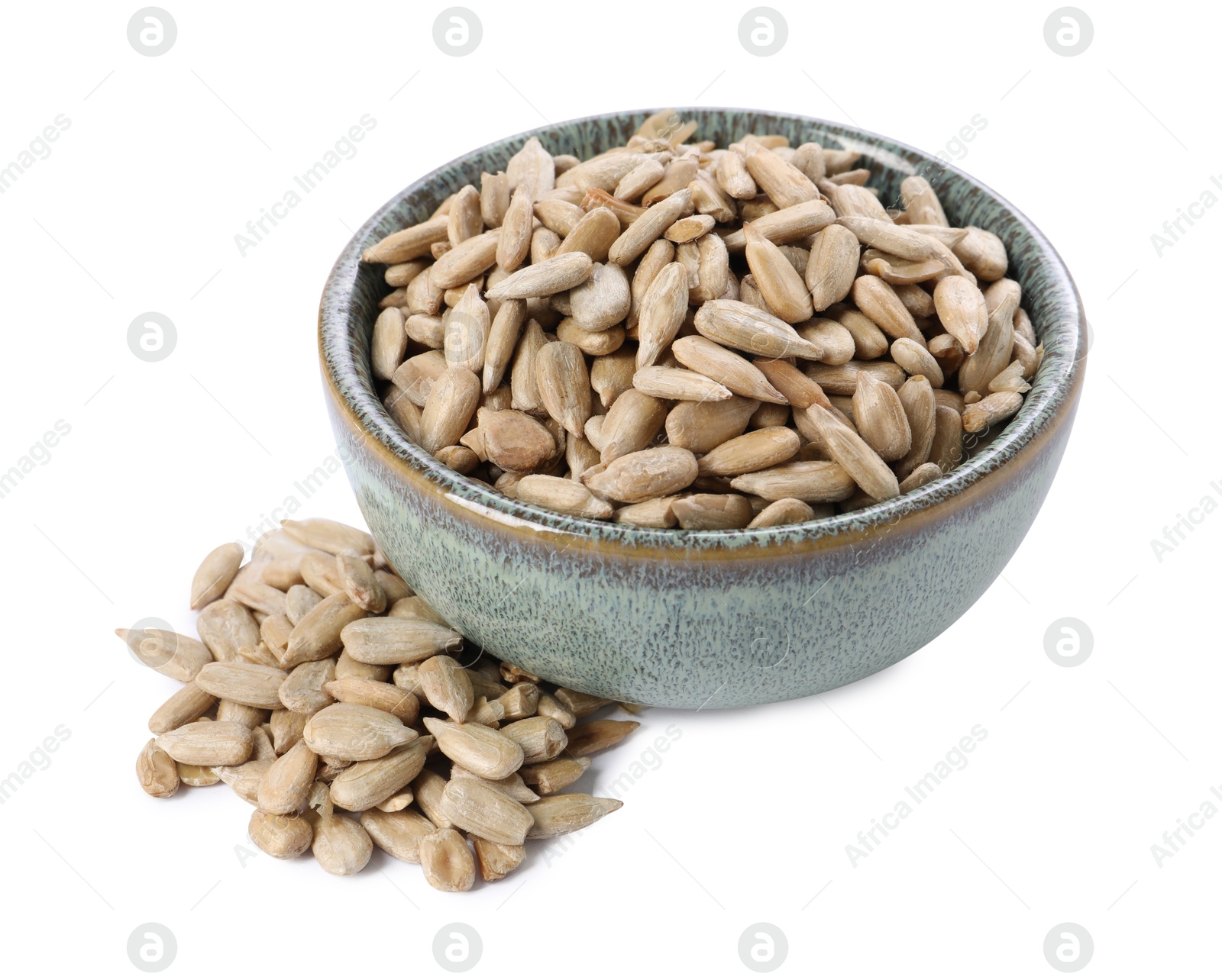 Photo of Peeled sunflower seeds in bowl isolated on white