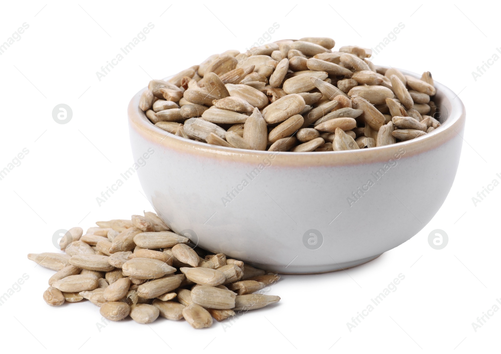 Photo of Peeled sunflower seeds in bowl isolated on white