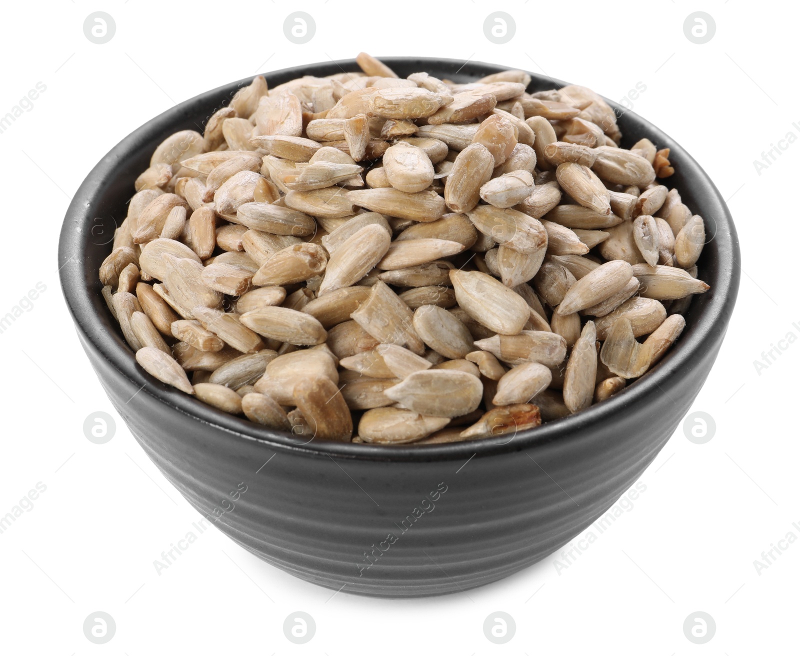 Photo of Peeled sunflower seeds in bowl isolated on white