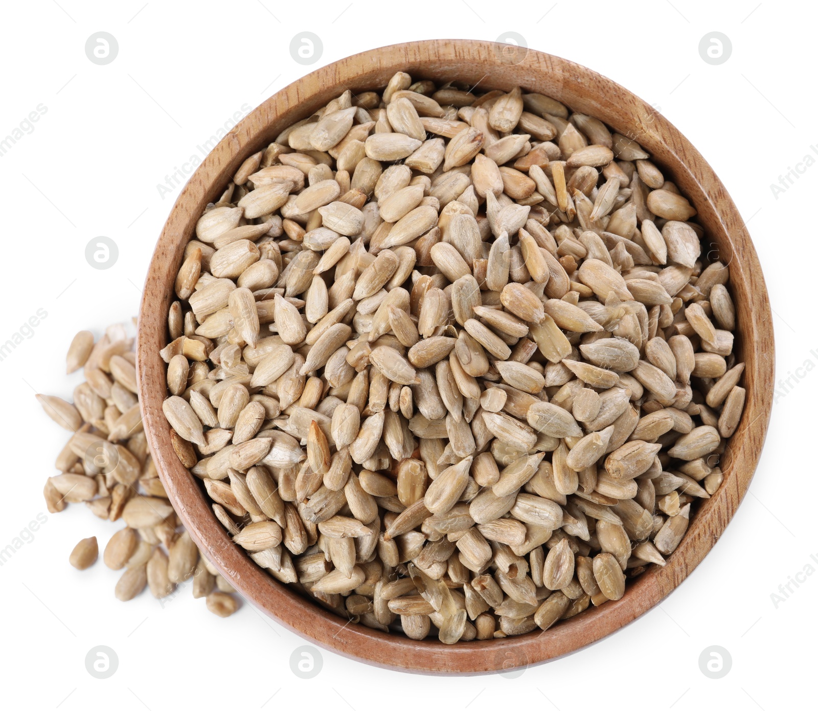 Photo of Peeled sunflower seeds in wooden bowl isolated on white, top view