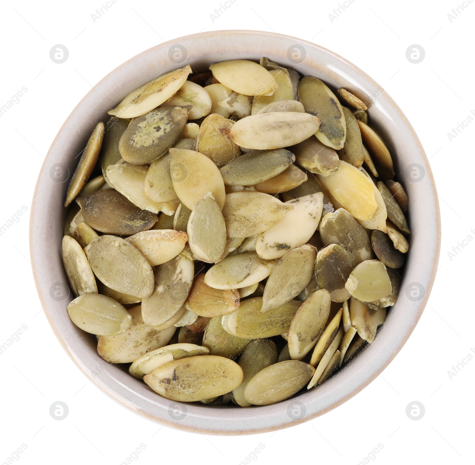 Photo of Peeled pumpkin seeds in bowl isolated on white, top view