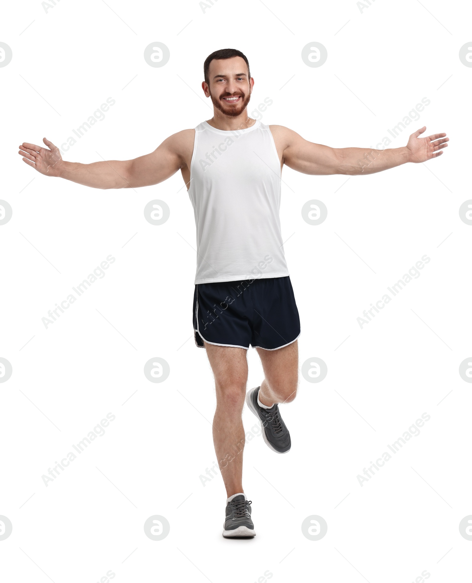 Photo of Handsome young man running on white background