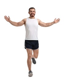 Handsome young man running on white background