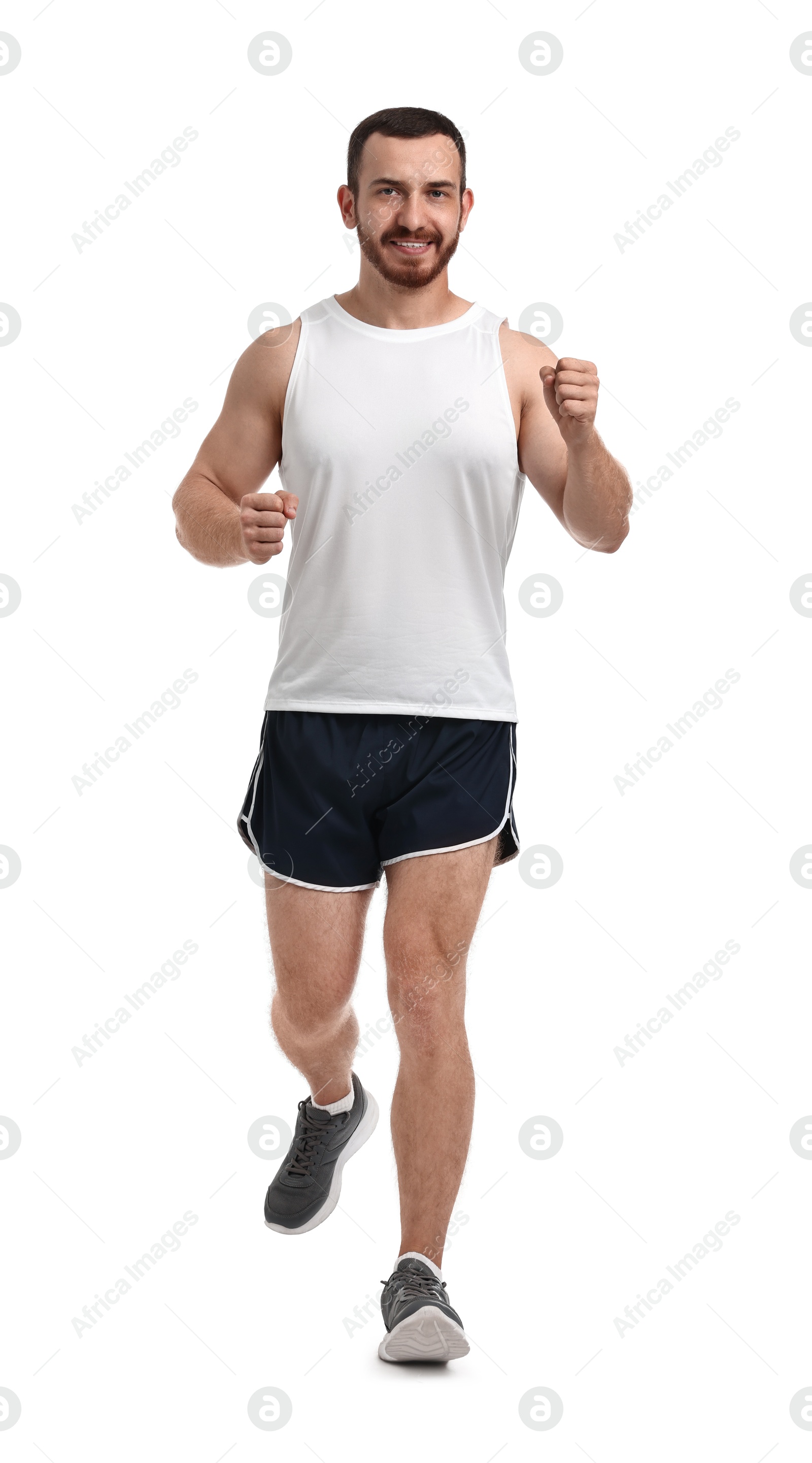 Photo of Handsome young man running on white background