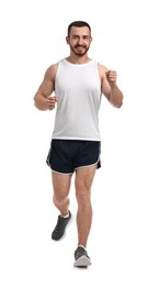 Handsome young man running on white background