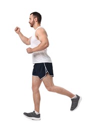 Handsome young man running on white background