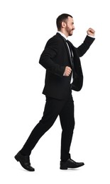 Photo of Young businessman in suit running on white background