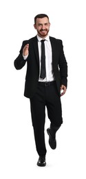 Photo of Young businessman in suit running on white background