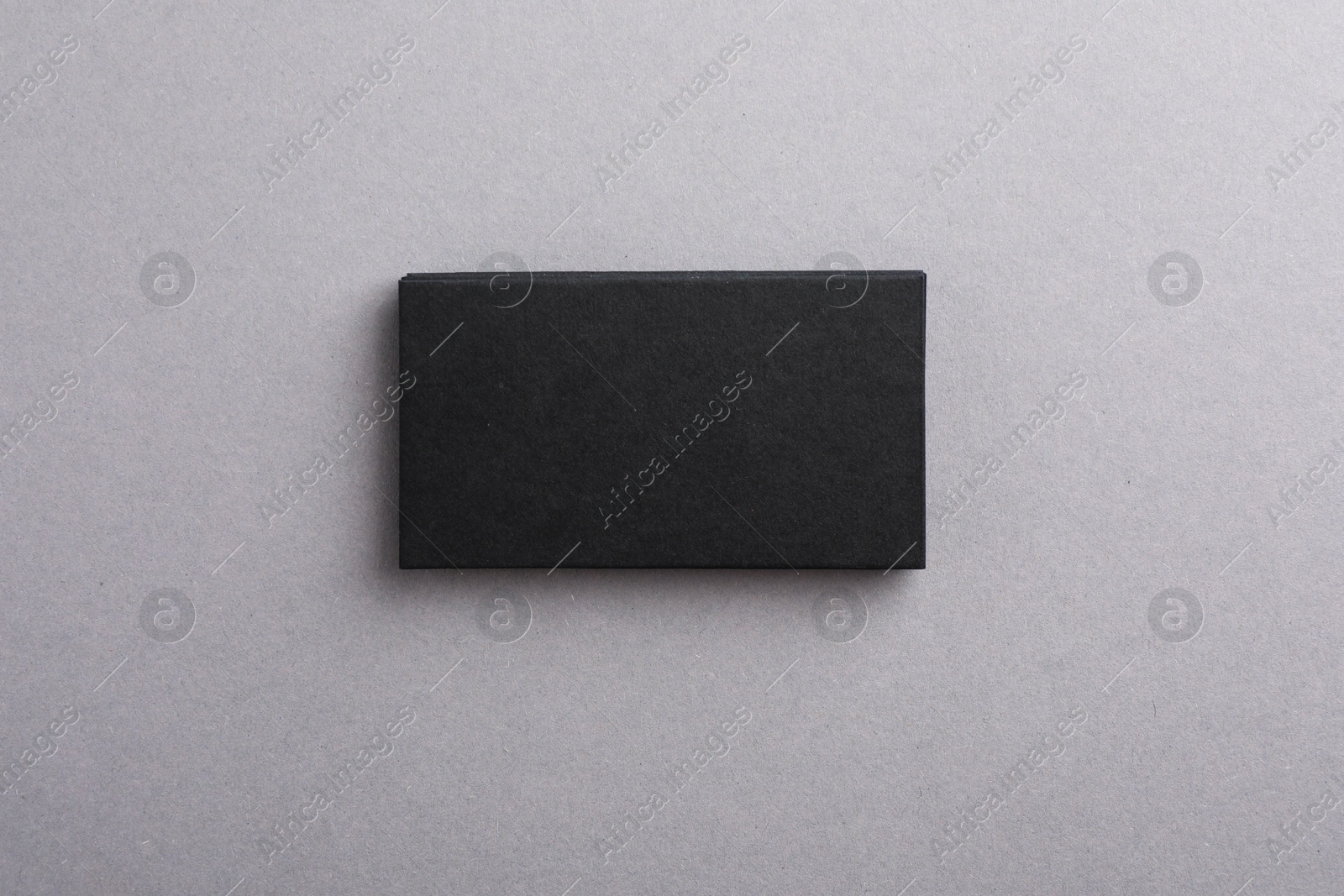 Photo of Blank business cards on grey background, top view. Mockup for design