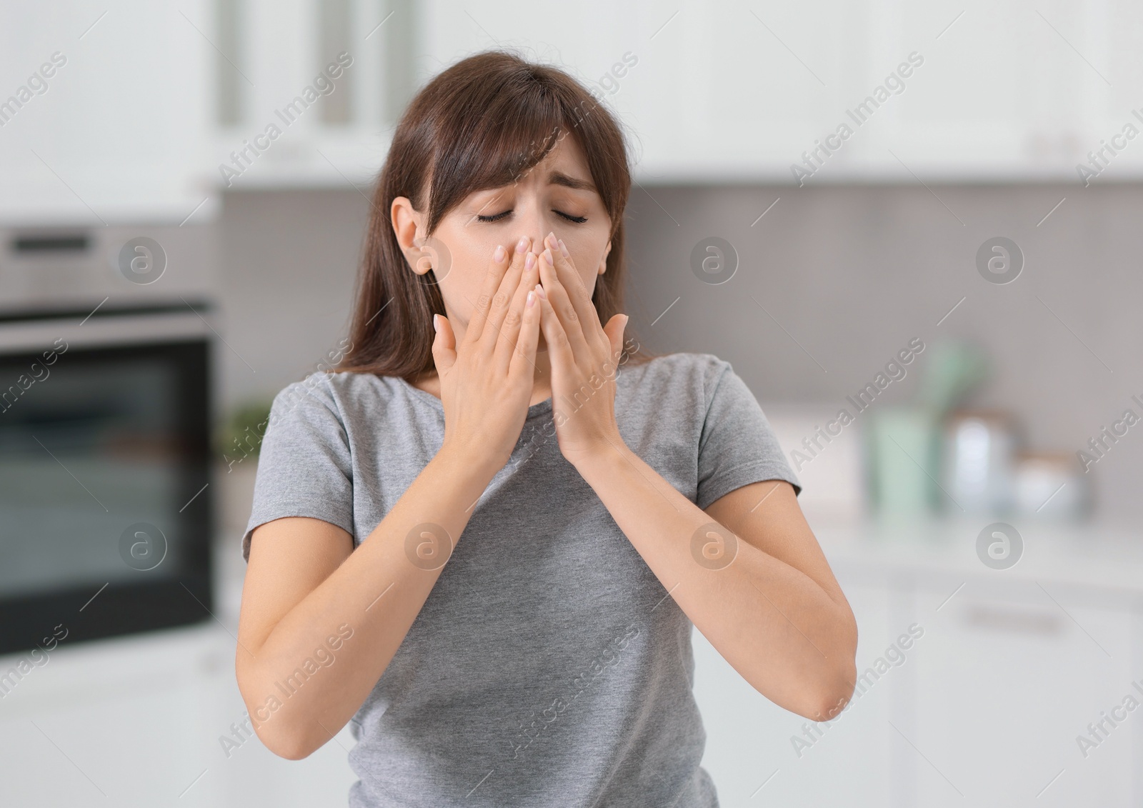 Photo of Tired woman suffering from sinusitis at home