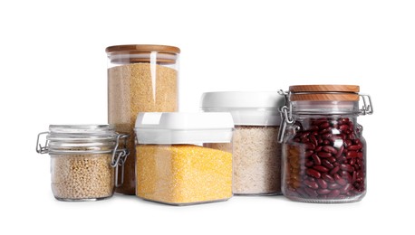 Different types of cereals and legumes in containers isolated on white