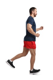 Handsome young man running on white background