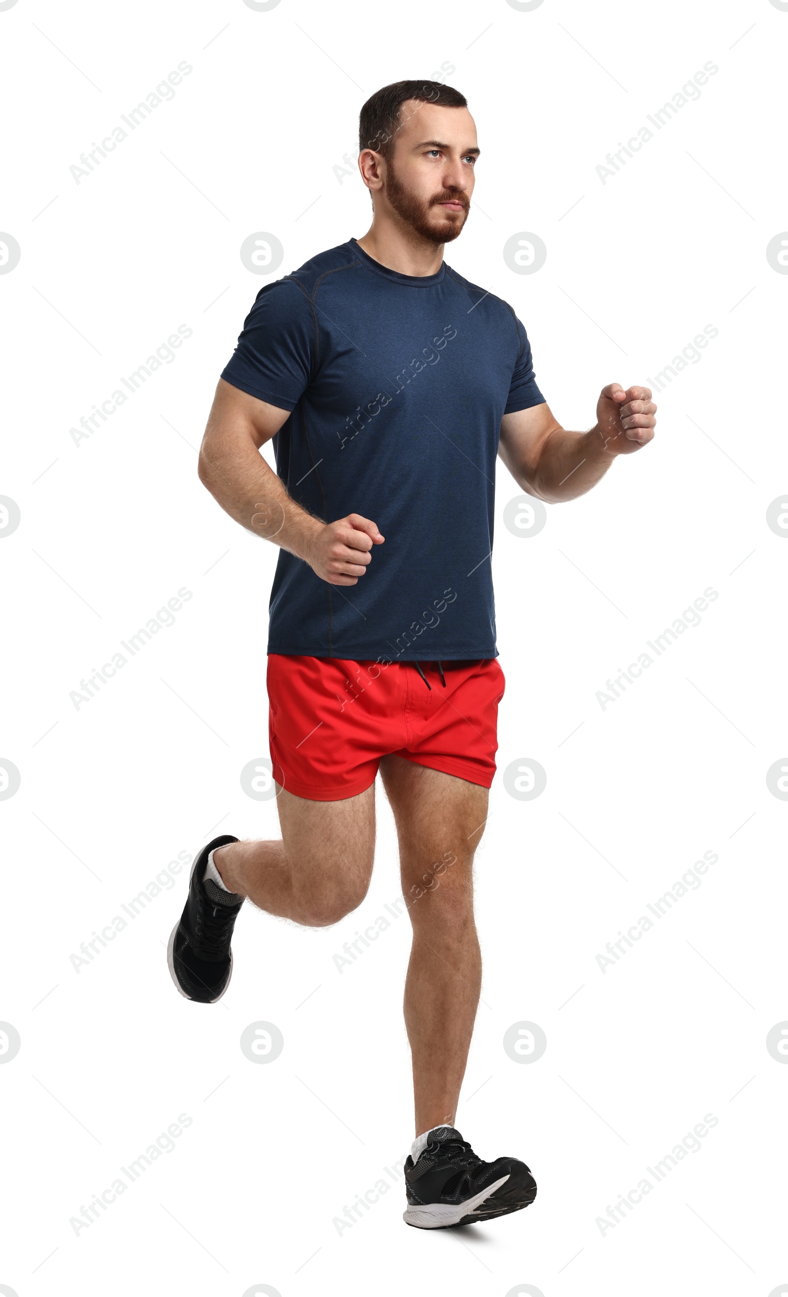 Photo of Handsome young man running on white background