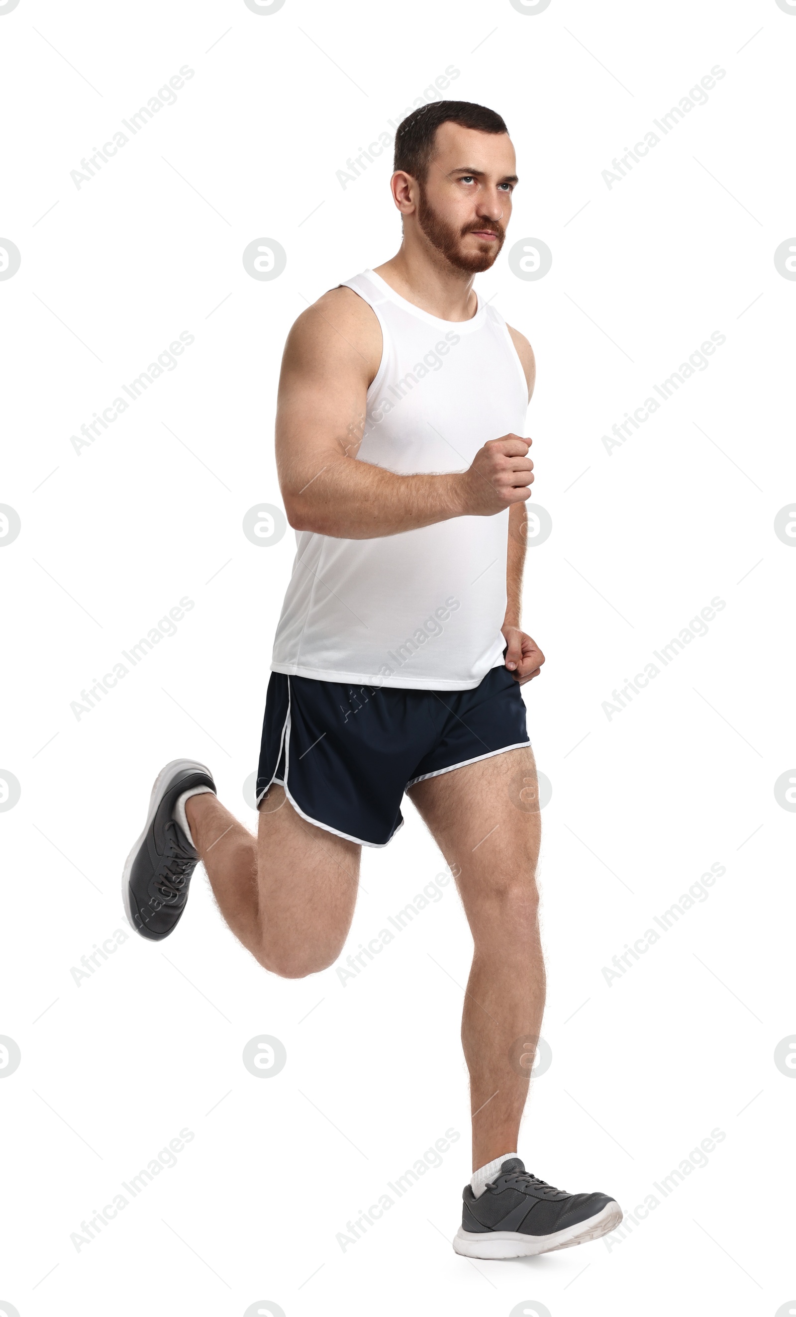 Photo of Handsome young man running on white background