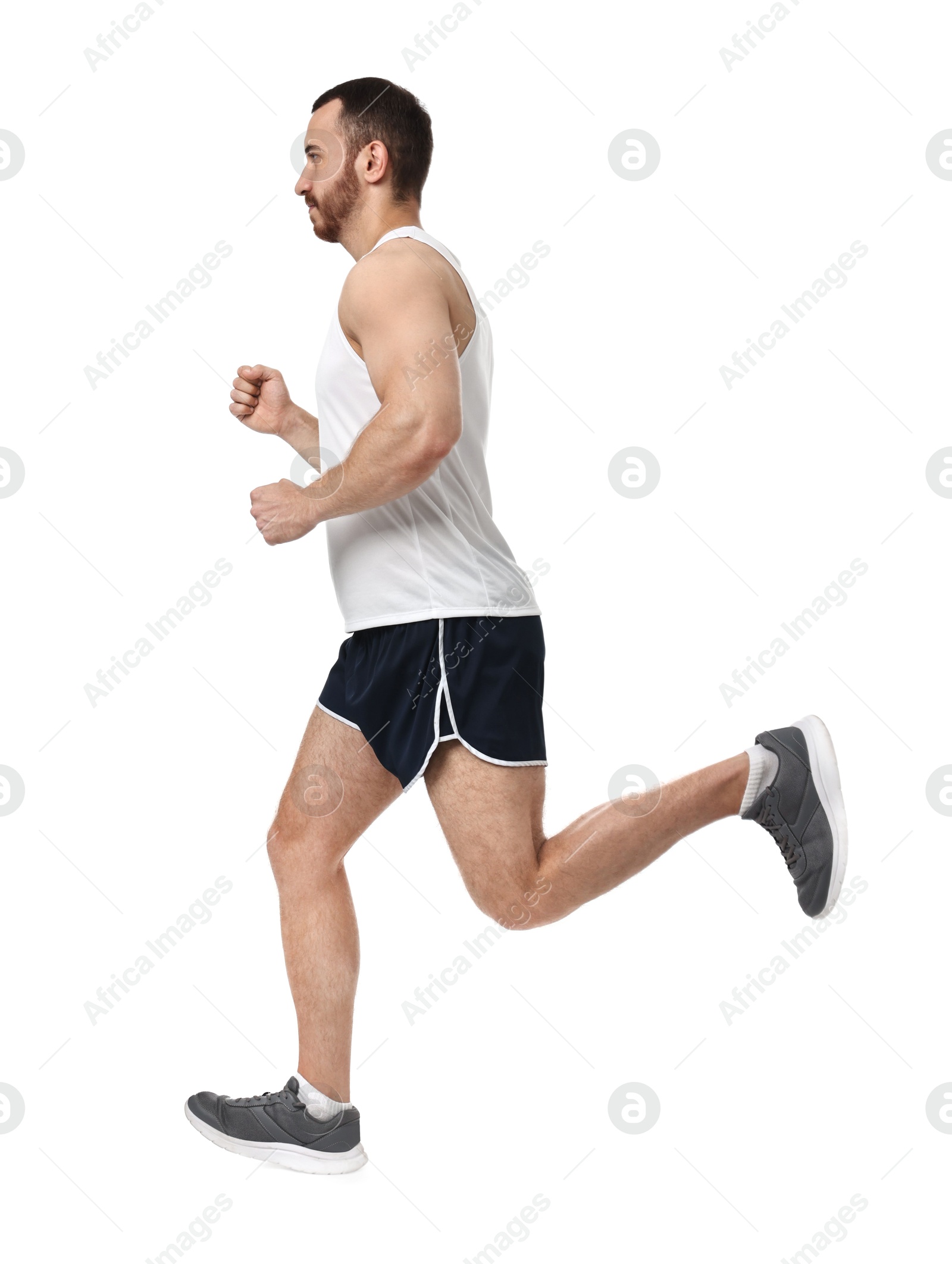 Photo of Handsome young man running on white background