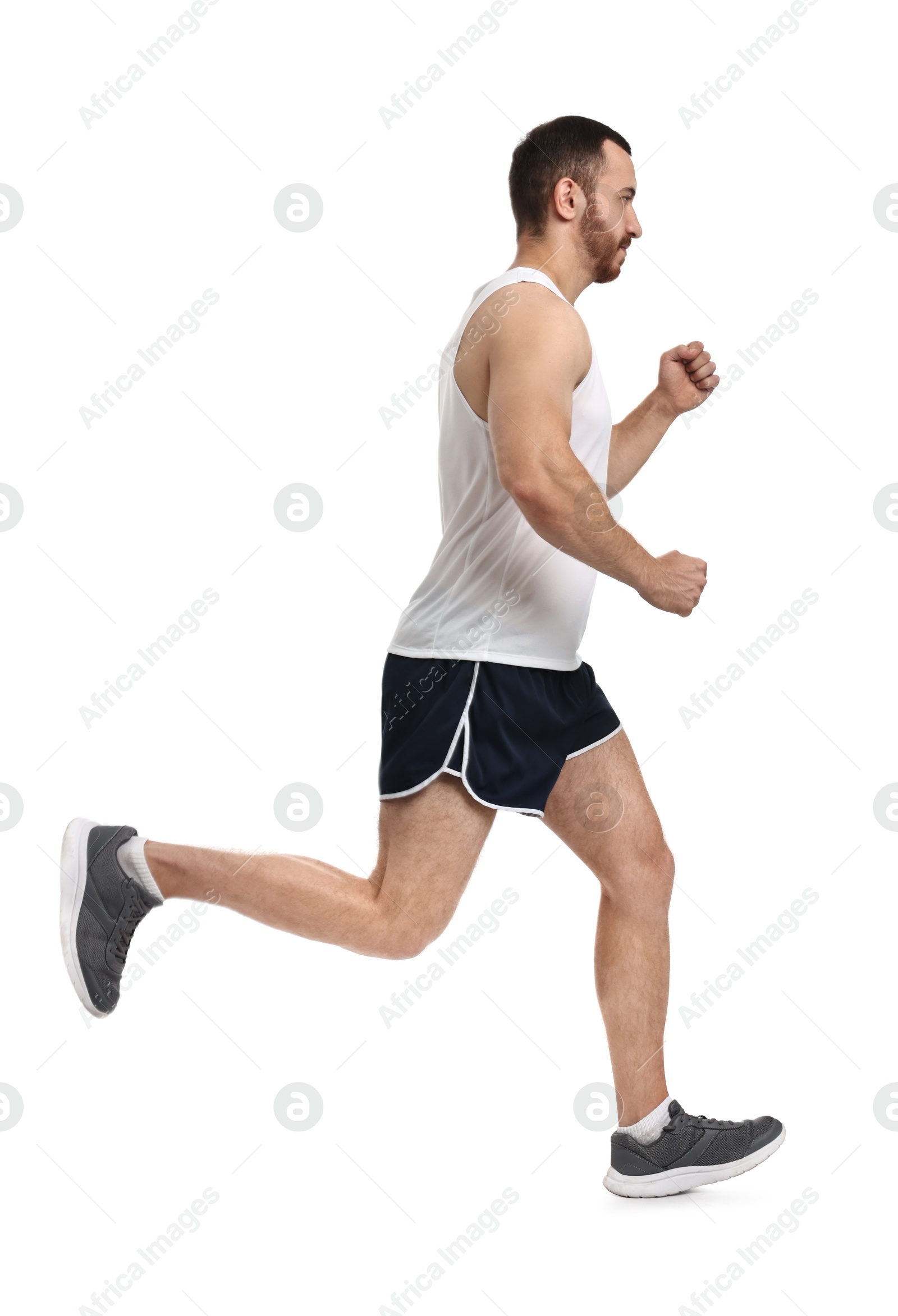 Photo of Handsome young man running on white background