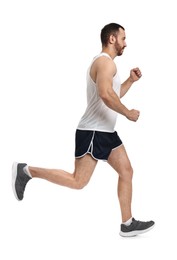 Photo of Handsome young man running on white background