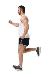 Photo of Handsome young man running on white background