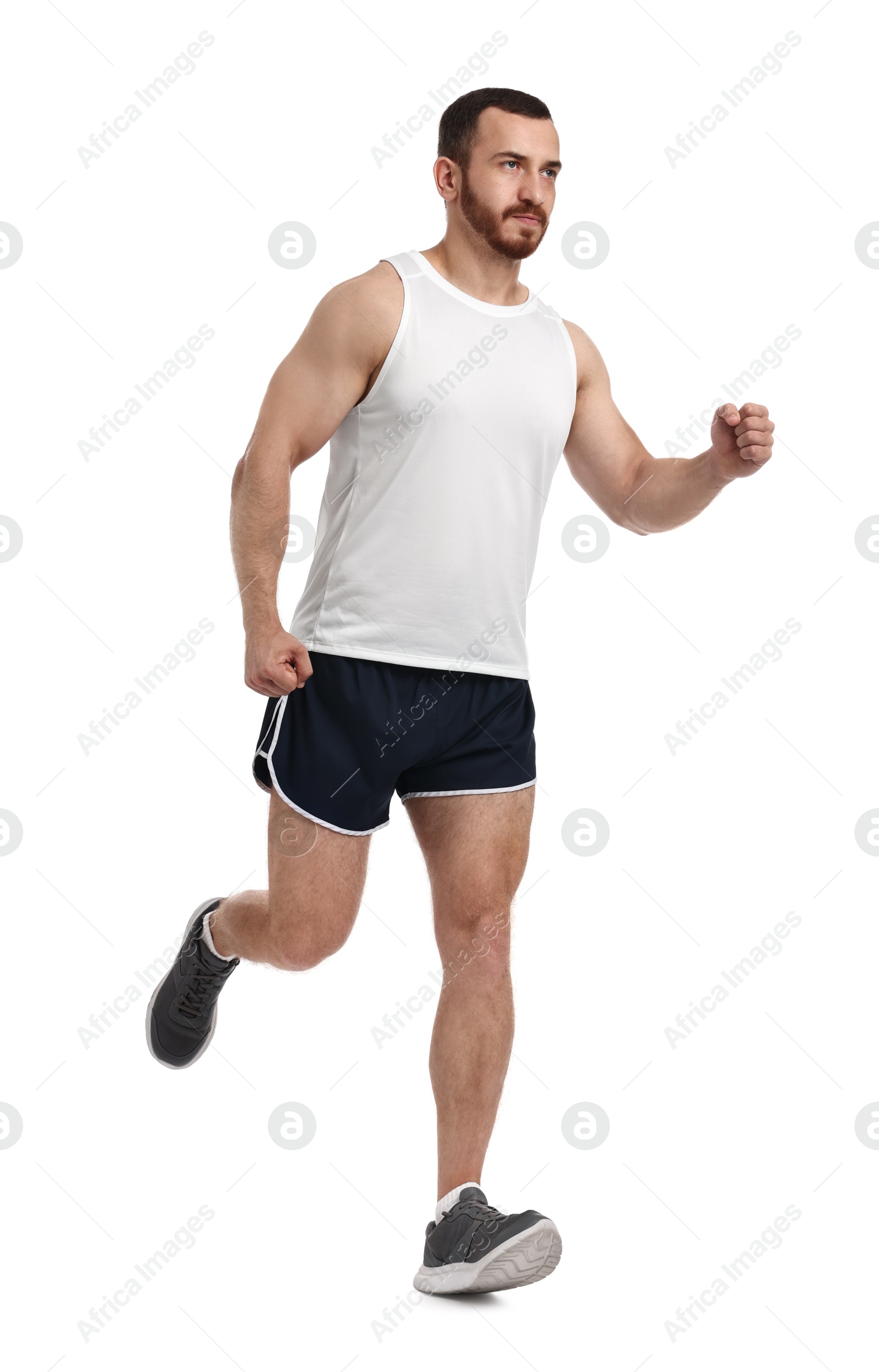 Photo of Handsome young man running on white background