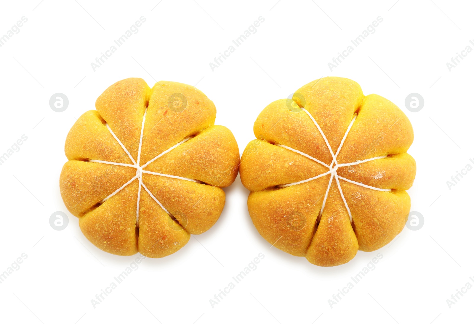 Photo of Tasty pumpkin shaped buns isolated on white, top view