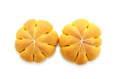 Photo of Tasty pumpkin shaped buns isolated on white, top view