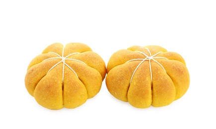 Photo of Tasty pumpkin shaped buns isolated on white