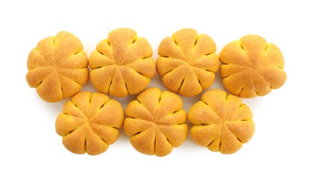 Photo of Tasty pumpkin shaped buns isolated on white, top view