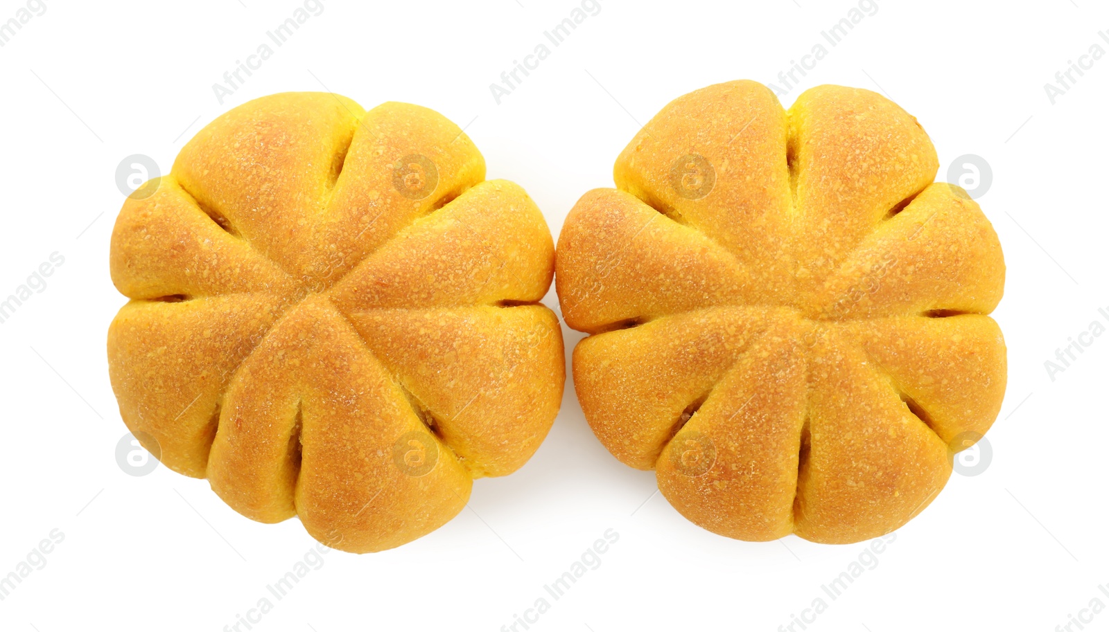 Photo of Tasty pumpkin shaped buns isolated on white, top view