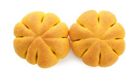 Photo of Tasty pumpkin shaped buns isolated on white, top view