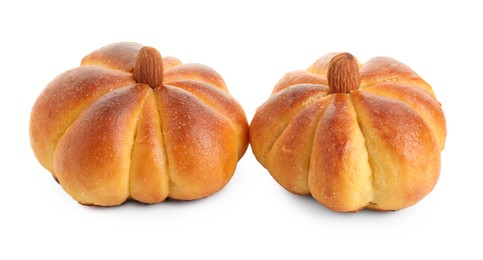 Photo of Tasty pumpkin shaped buns isolated on white