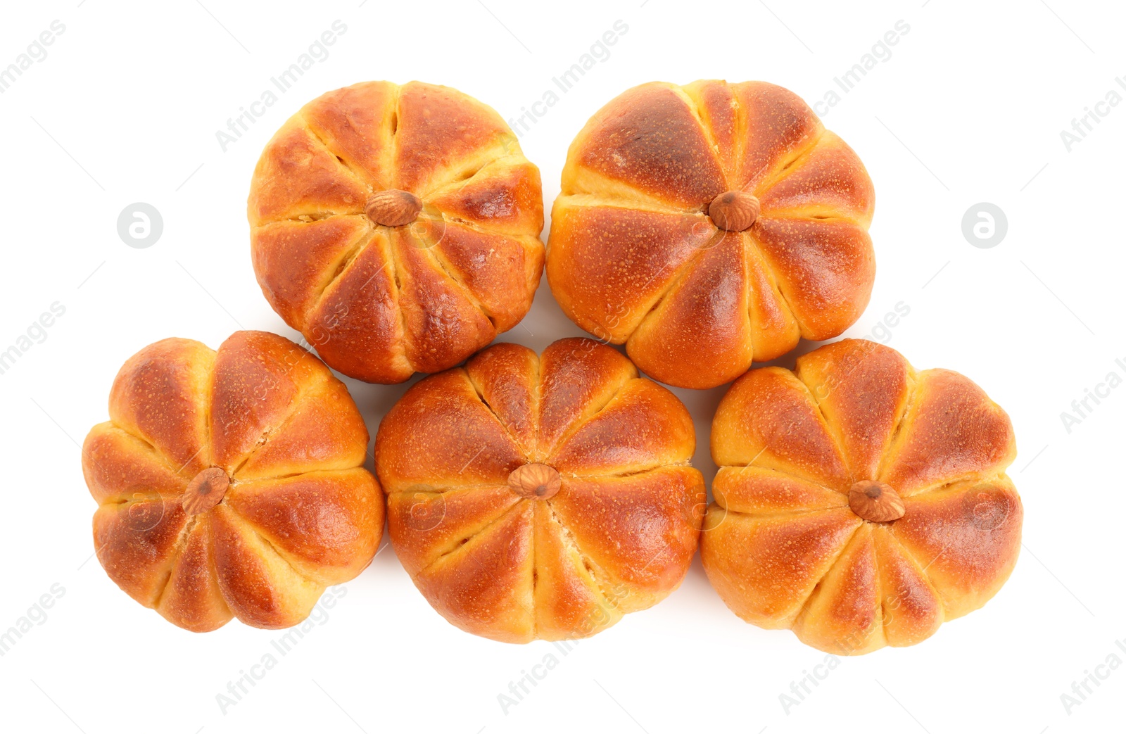 Photo of Tasty pumpkin shaped buns isolated on white, top view