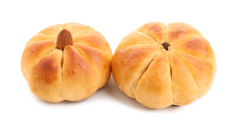 Photo of Tasty pumpkin shaped buns isolated on white