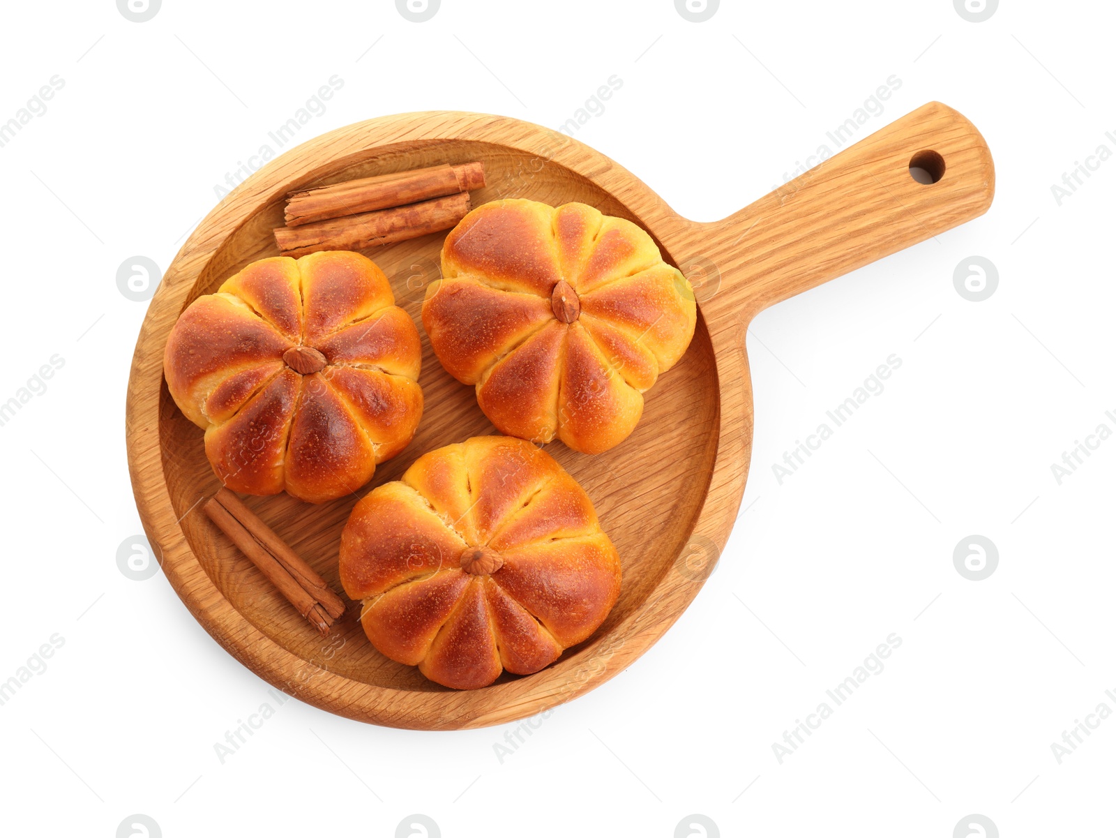 Photo of Tasty pumpkin shaped buns and cinnamon sticks isolated on white, top view