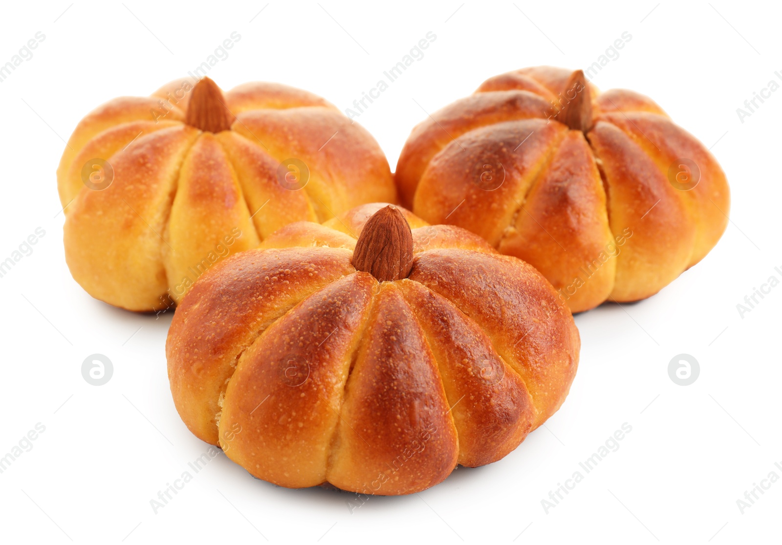 Photo of Tasty pumpkin shaped buns isolated on white