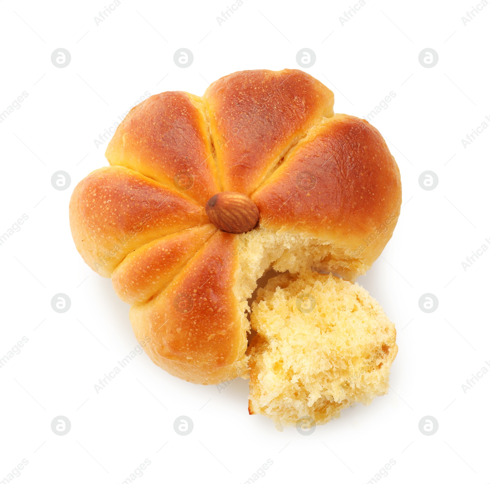 Photo of One tasty pumpkin shaped bun isolated on white, top view