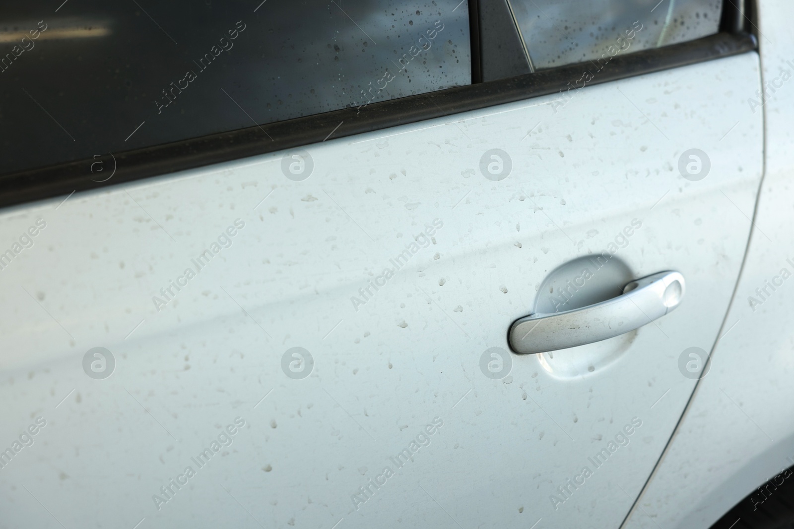 Photo of Modern auto with dirty stains, closeup view