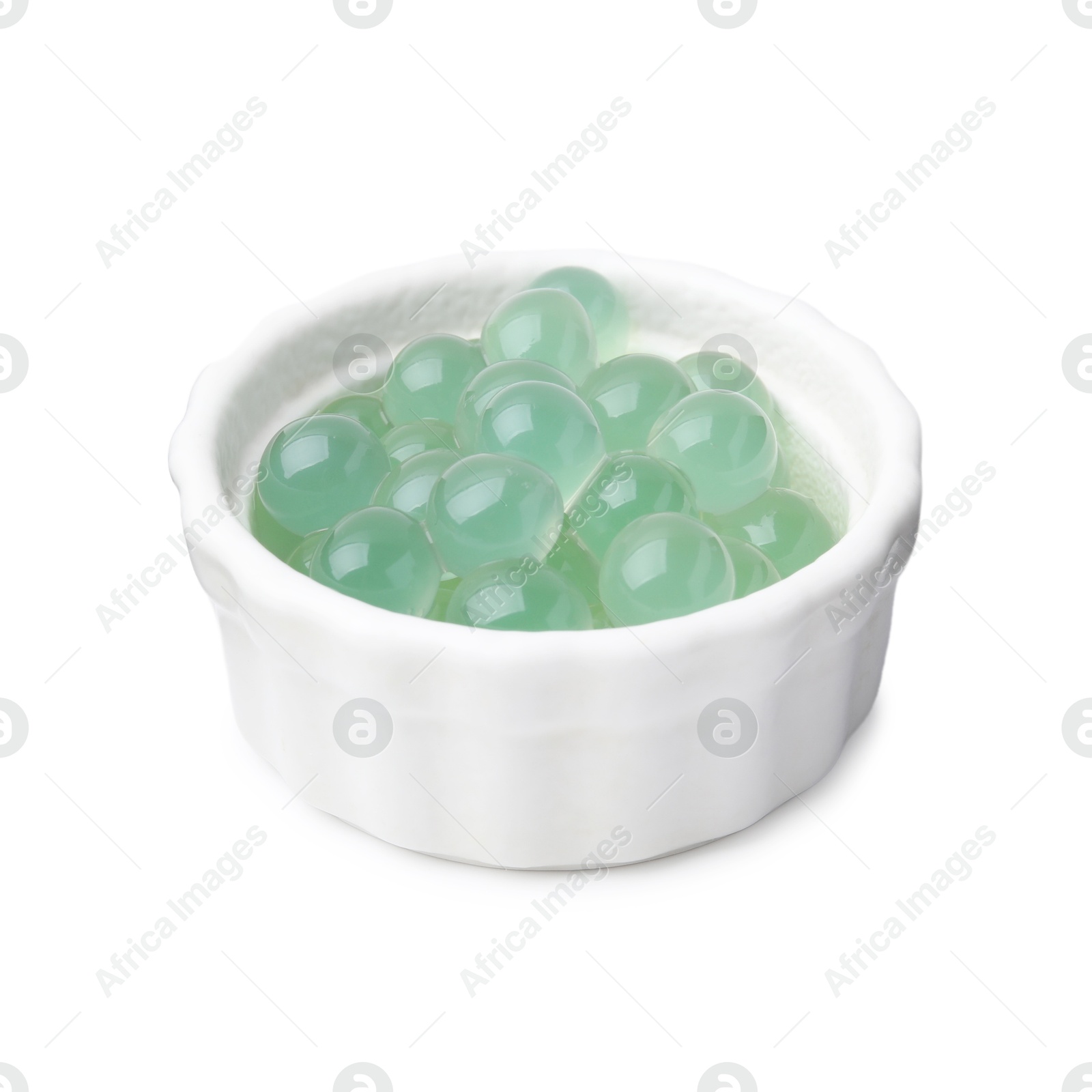 Photo of Bright tapioca pearls in bowl isolated on white