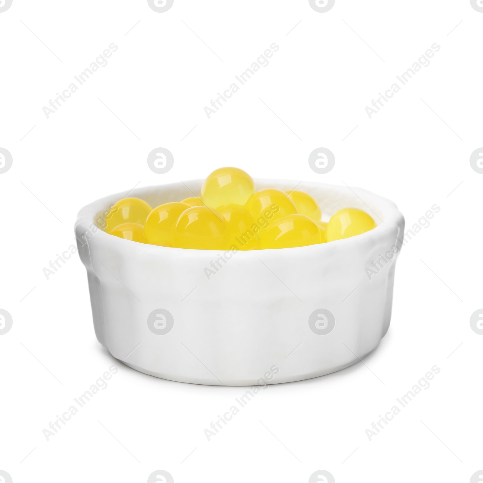 Photo of Bright tapioca pearls in bowl isolated on white