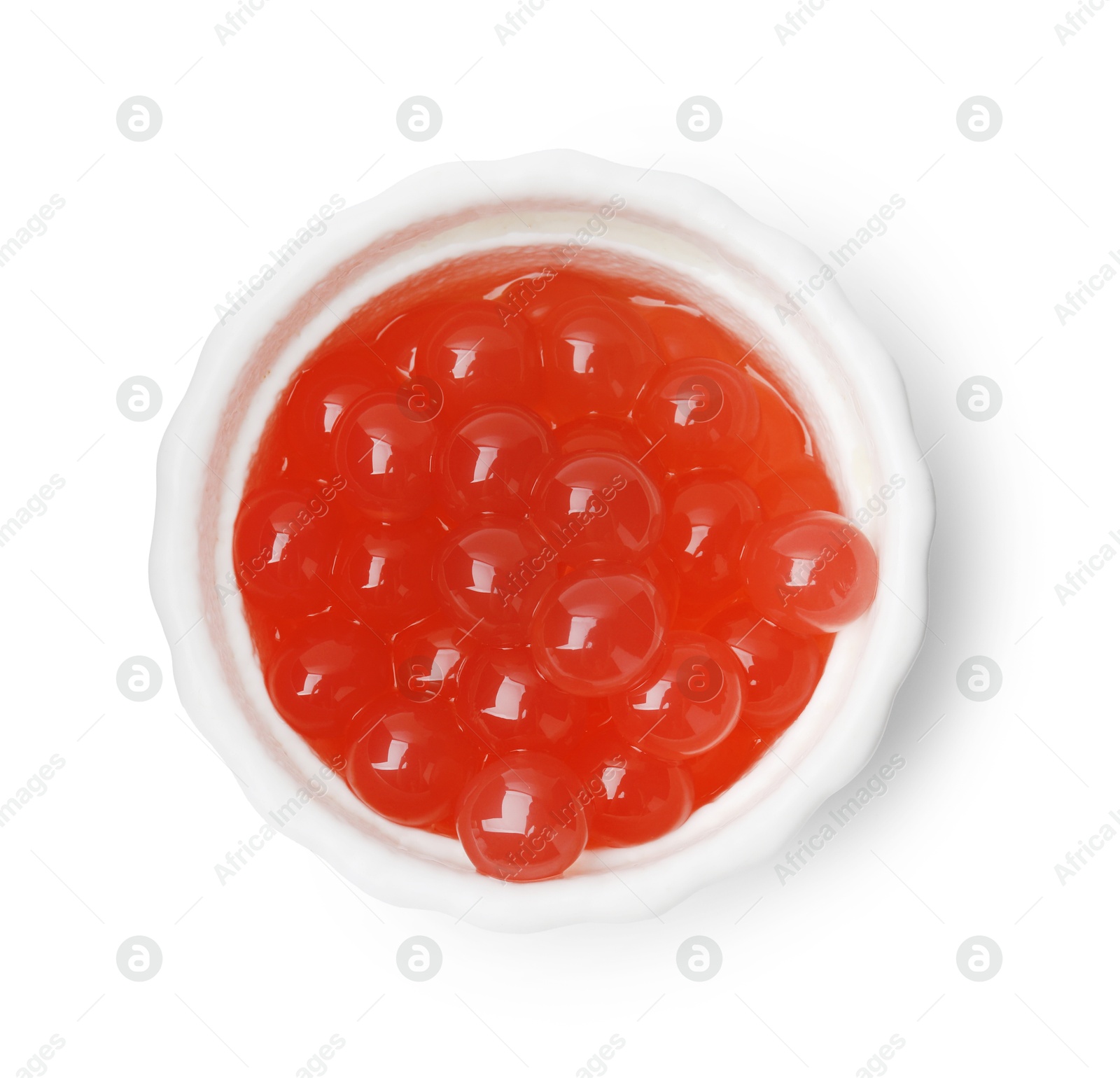 Photo of Bright tapioca pearls in bowl isolated on white, top view