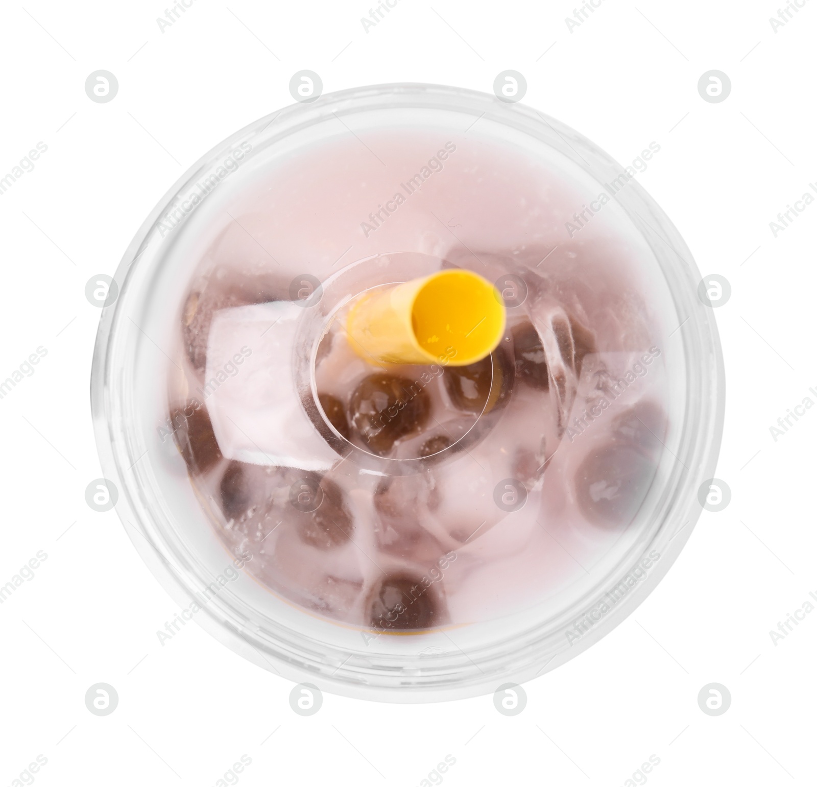 Photo of Tasty milk bubble tea in plastic cup isolated on white, top view