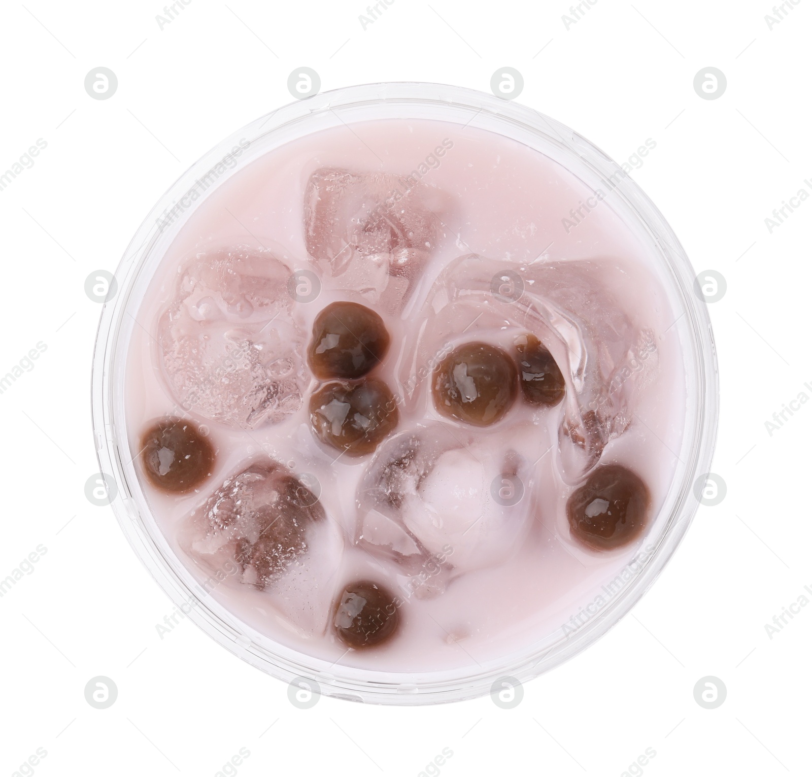 Photo of Tasty milk bubble tea in plastic cup isolated on white, top view