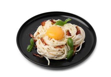 Photo of Delicious pasta Carbonara with egg yolk, bacon and basil isolated on white