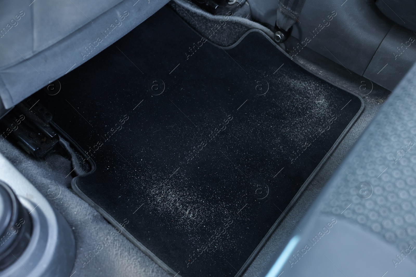 Photo of Black soft car floor mat in auto