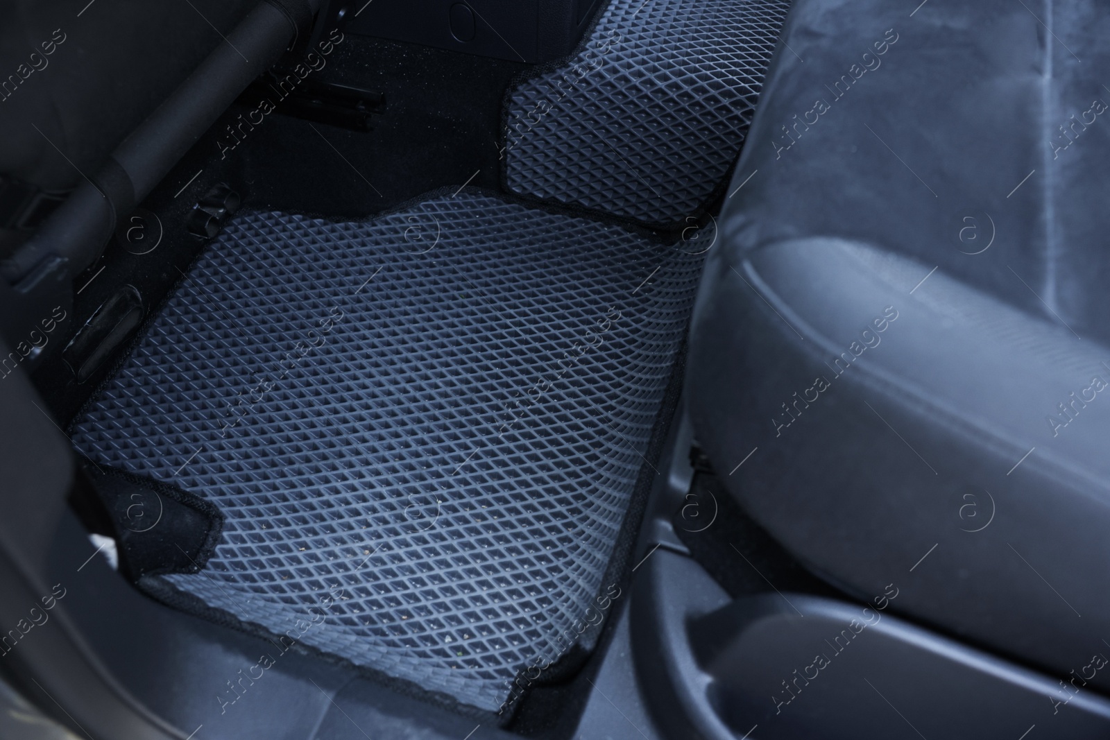 Photo of Grey rubber car floor mat in auto