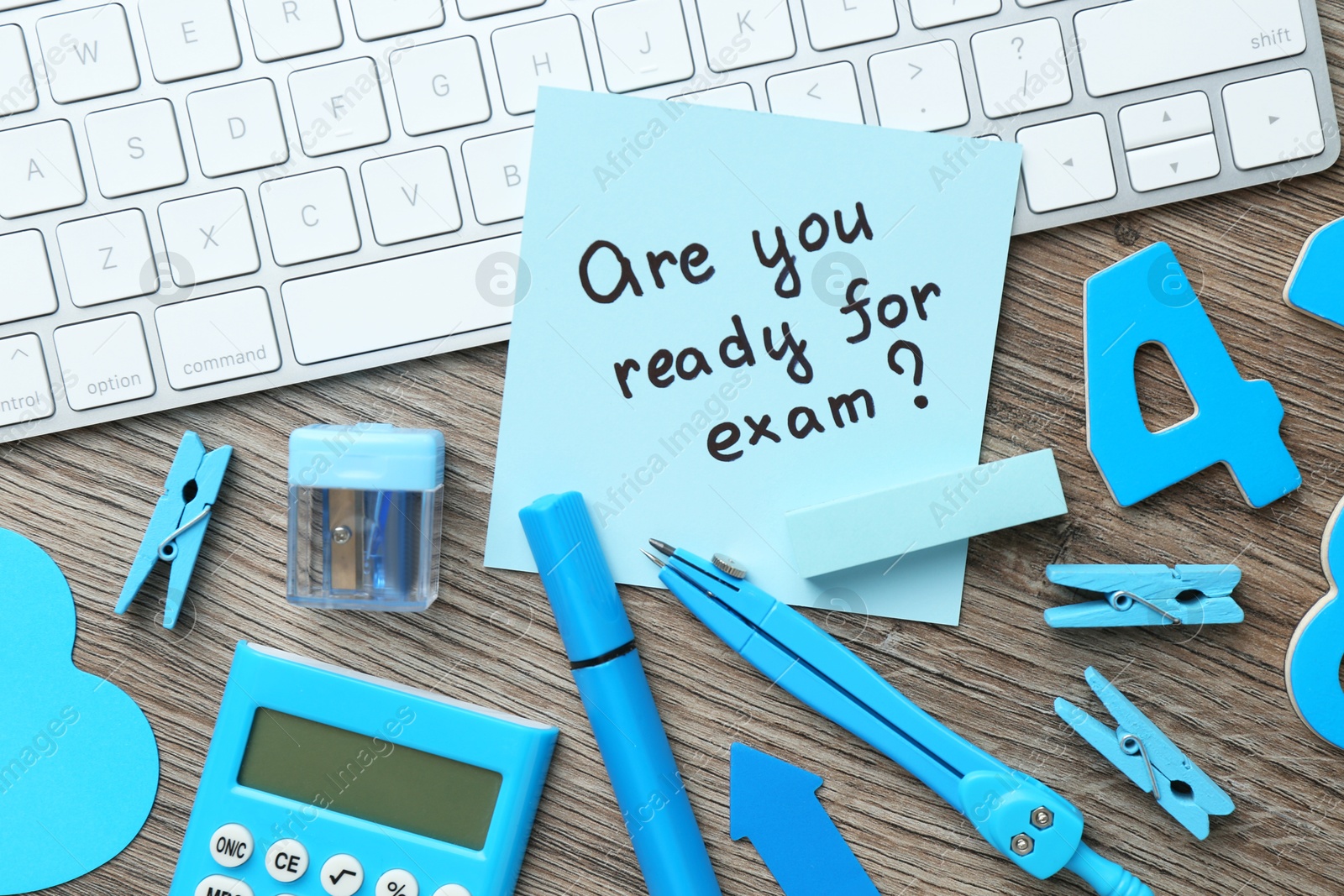 Photo of Note with question Are You Ready For Exam and stationery on wooden desk, flat lay