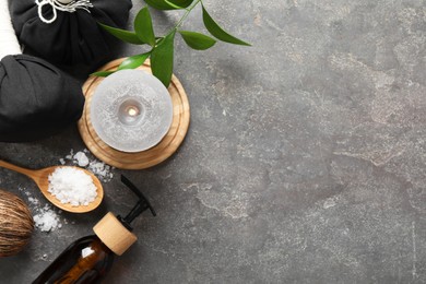 Photo of Flat lay composition with different spa products on grey textured table, space for text