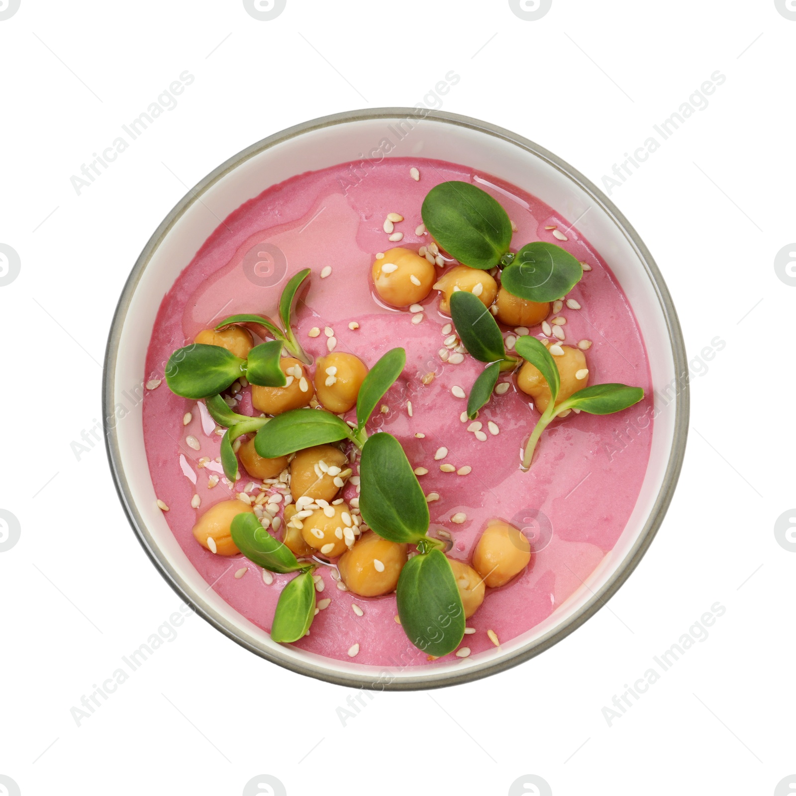 Photo of Tasty beetroot hummus and chickpeas in bowl isolated on white, top view