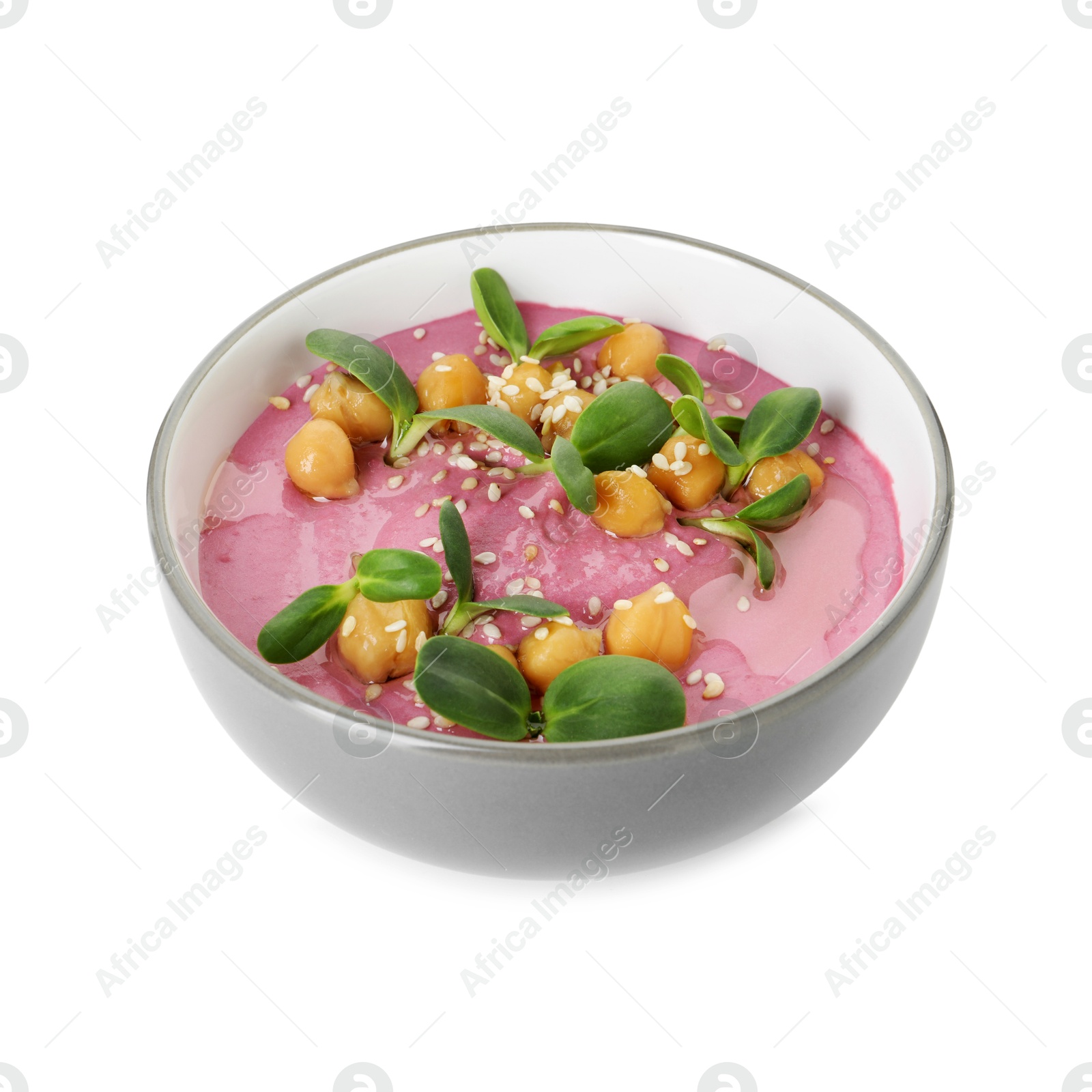 Photo of Tasty beetroot hummus and chickpeas in bowl isolated on white